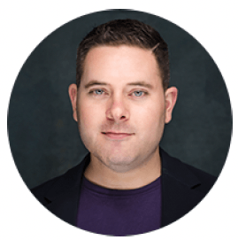 Headshot of a man in a purple shirt