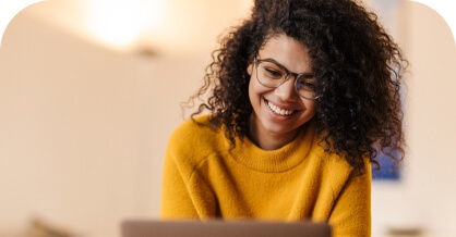 Woman in a yellow sweater smiling