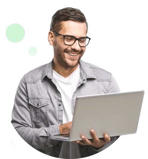 Man in a denim shirt using a laptop