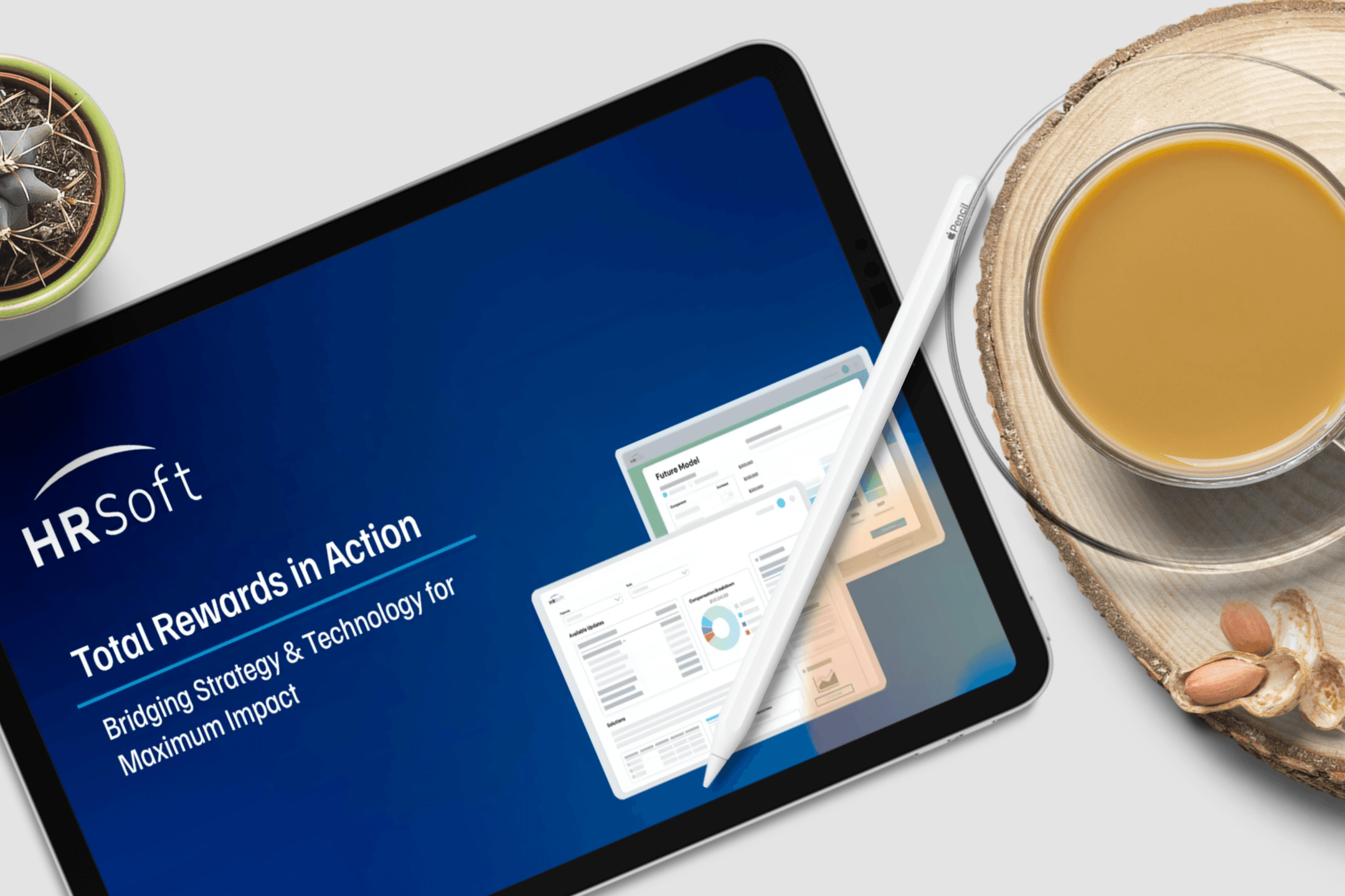 Tablet displaying an HRSoft 'Total Rewards in Action' presentation on a desk