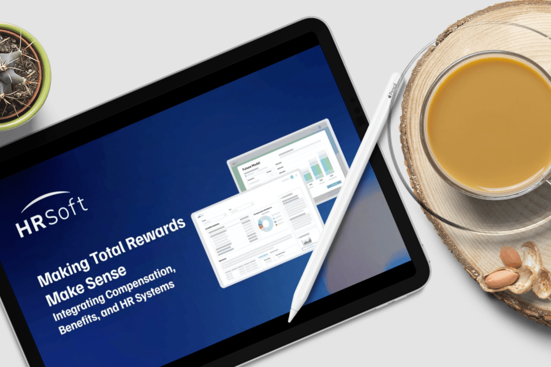 Tablet displaying an HRSoft Total Rewards presentation on a desk
