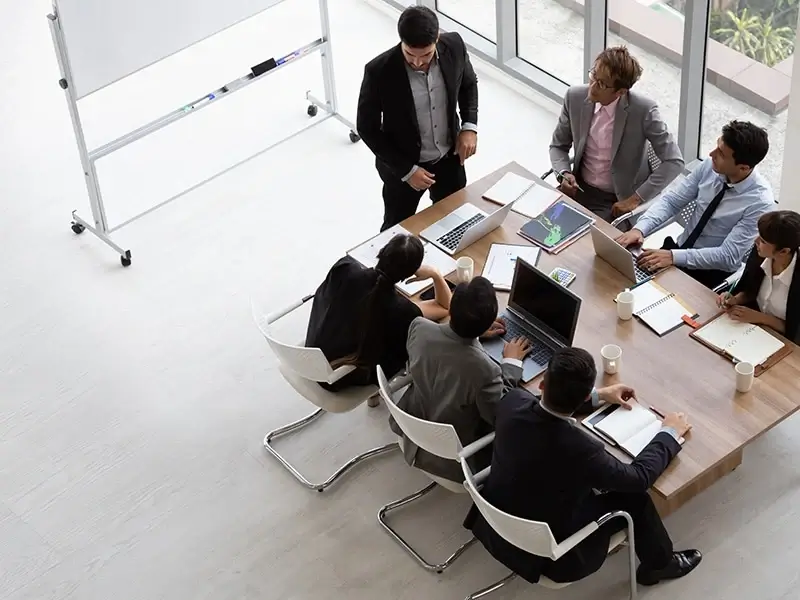 Team meeting around a table in an office