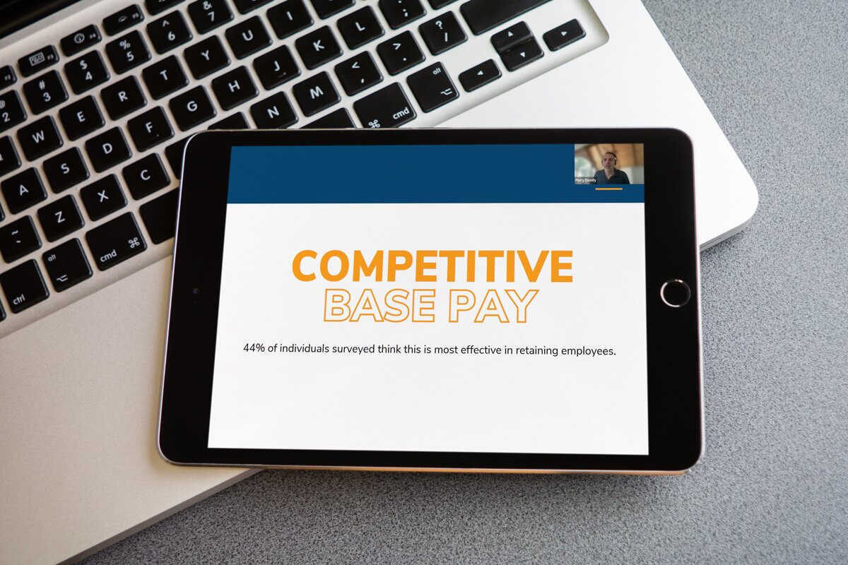 Tablet displaying an HRSoft webinar titled 'Competitive Base Pay'