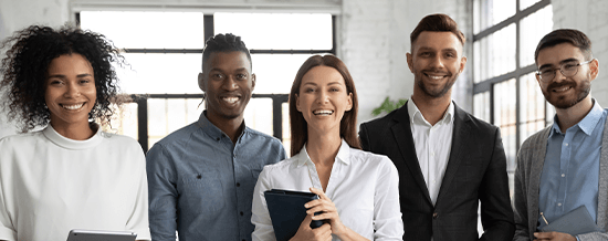 Group of five diverse professionals smiling together