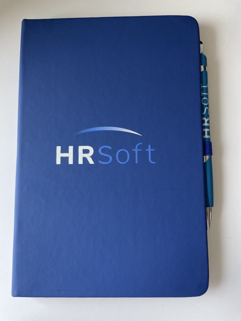 HRSoft-branded journal with a pen
