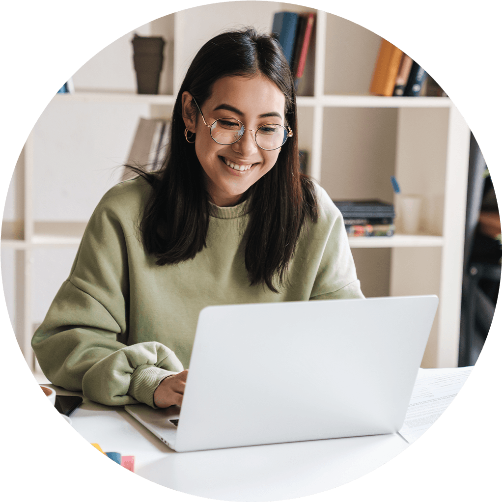 Smiling woman working at a laptop
