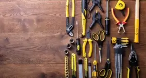 Collection of tools hanging on a wooden wall