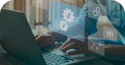 Hands typing on a laptop with digital gear and people icons overlay