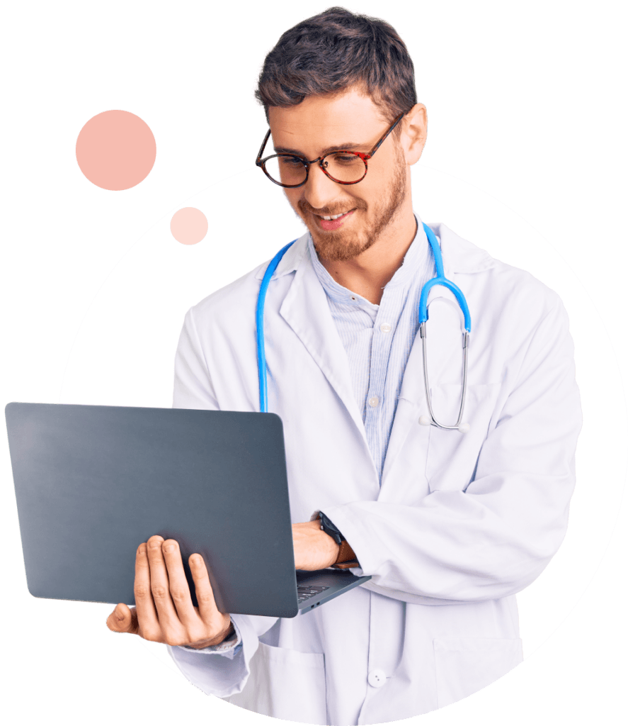 Doctor in a white coat holding a laptop